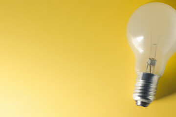 Image of a light bulb on a yellow background