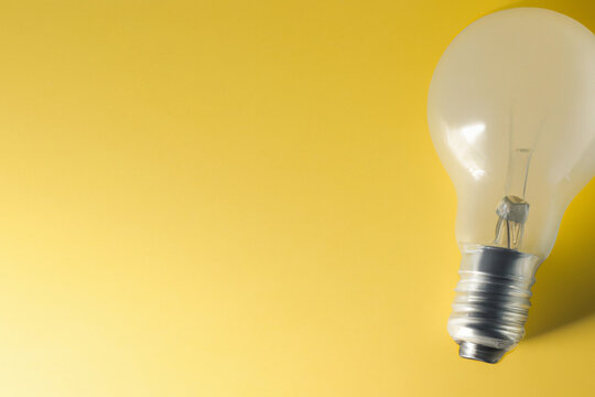 Image of a light bulb on a yellow background