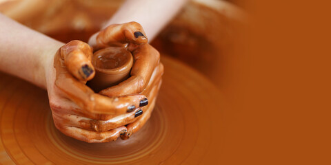 Master making a pot on pottery wheel, copy space,banner