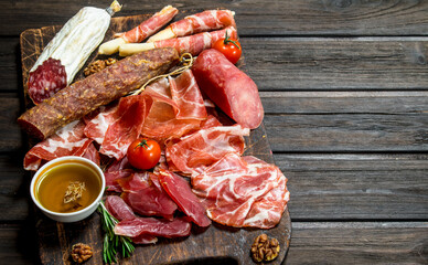 Antipasto background. Assortment of meat snacks on the Board .