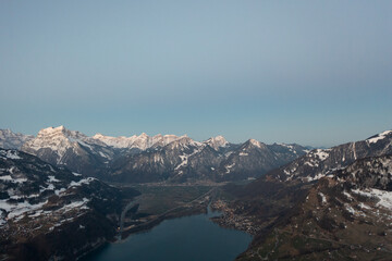 Fototapeta na wymiar Amazing sunrise in canton Glarus in Switzerland at a mountain lake called Walensee.