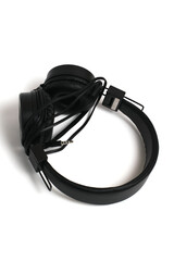 Black headphones on a white background. Cheap headphones for listening to music
