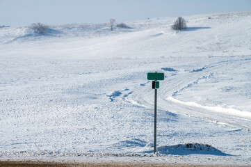 sign on the road in the snow