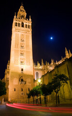 Fototapeta premium Looking up at the Giralda, Seville, Spain, Night scene.