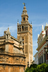 The Giralda tower in Seville, Spain with the Cathedral in foreground