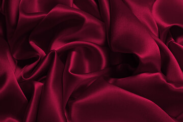 Rich and luxury viva magenta silk fabric texture background.