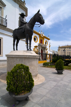 The entrance to the Plaza de toros, or the Bull Ring.  Seville, Andalusia, Spain, with picador statue.