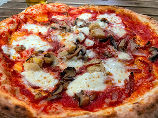 Traditional Neapolitan pizza service at a pizzeria in Naples, Italy