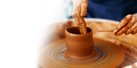 Cropped Image of hands working with Pottery Wheel, close up of shaping clay edges, banner, copy space