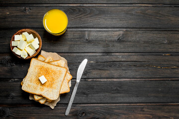 Toasted bread with butter and orange juice.