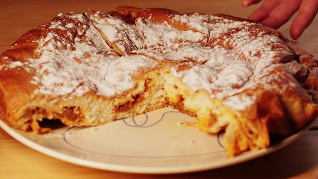 Ensaimada pie close up, a Spanish pastry typical of Mallorca, Majorca, Spain. Traditional dessert. 