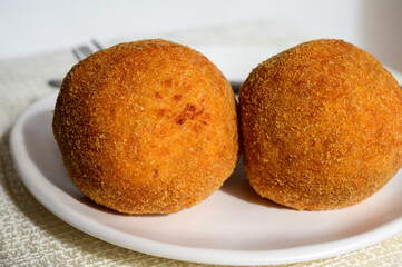 Traditional street food in UK, stuffed fried Scotch eggs with breadcrumbs