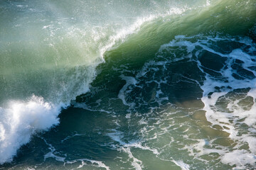 A breaking wave on a sunny day