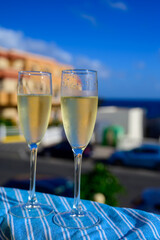 Dinner party, drinking of cava or champagne sparkling wine in vacation resort Caleta Fuste, Fuerteventura, Canary islands vacation, Spain