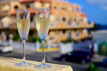 Dinner party, drinking of cava or champagne sparkling wine in vacation resort Caleta Fuste, Fuerteventura, Canary islands vacation, Spain