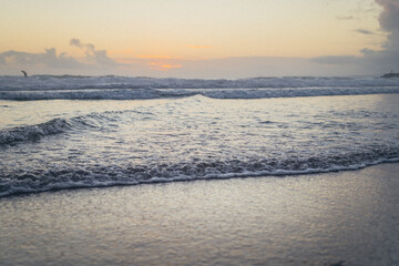 sunset in the winter above the waves of the ocean. recreation concept