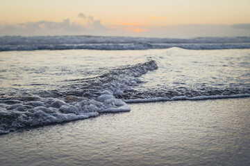 sea waves with an incredible sunset. the concept of loneliness. clean sea sand and ocean waves