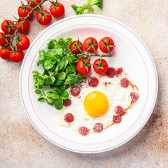 fried egg sausages, vegetable breakfast fresh meal food snack on the table copy space food background rustic top view