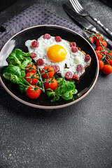 fried egg sausages, vegetable breakfast fresh meal food snack on the table copy space food background rustic top view