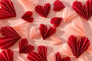Valentines day flat lay. Stylish pink and red hearts composition on pink paper background. Happy Valentine's day! Modern cute valentine hearts cutouts. Creative love background