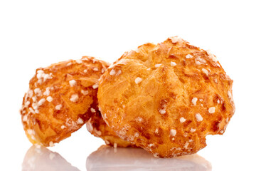 Three sweet chouquette, close-up, isolated on white.