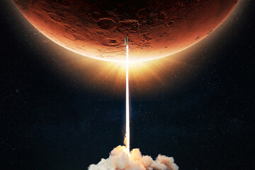 New space shuttle rocket with a blast takes off into space against the background of the red planet...