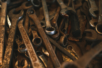 rusty metal wrenches in a pile