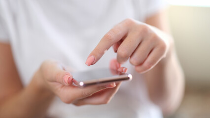 Close-up of smartphone in hands of woman.