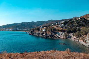 Fototapeta na wymiar Kionia Beach swimming, the place to embrace the Aegean Sea, Tinos, Greece