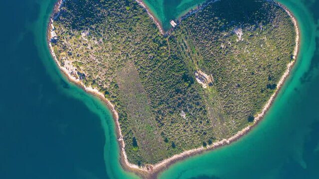 Aerial drone view of Galesnjak the Island of Love in Croatia with beautiful blue turquoise sea water. Heart shaped Island. Travel and holidays destination. Amazing tourism in Croatia Islands.