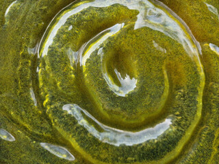 abstract glass texture. yellow green glass background. glass in shape of a rose