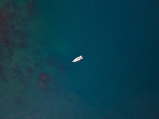 Lonely yacht in the middle of the ocean