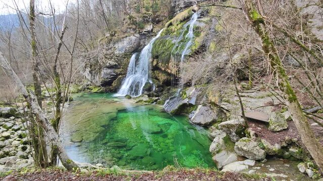 The Picturesque Slap Virje Waterfall of Bovec, Slovenia. The waterfall is an incredible pearl of nature. Magical location for relaxing and meditation. 