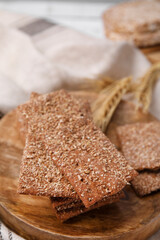 Stack of dry rye crispbreads on table, closeup
