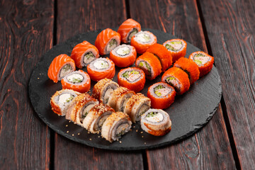Rolls set with fish shrimp and caviar sushi with chopsticks - asian food and japanese cuisine concept