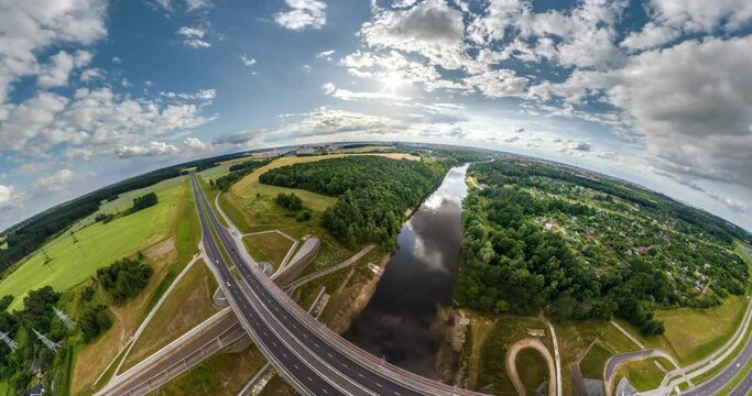 circular rotation with twisting of the landscape of the forest and bridge over river height of the flight into a tiny planet and transformation into a blue sphere