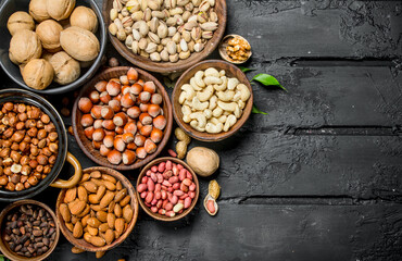 Assortment of different nuts in bowls.