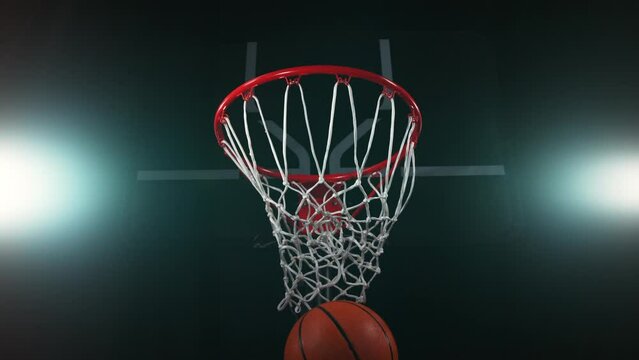 Super slow motion of basketball player hitting the basket. Filmed on high speed cinema camera Phantom, 1000fps. Speed ramp effect.