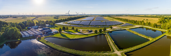 Environmentally friendly installation of photovoltaic power plant and wind turbine farm situated by...