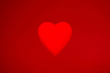 Background material for Valentine's Day with a red heart object on a red background