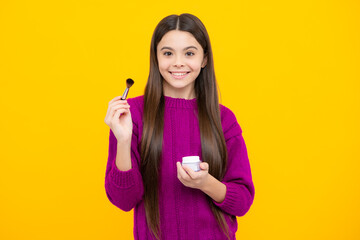 Kids make up products. Makeup teen child artist apply face powder with make up brush. Beauty, and cosmetics for teenagers.