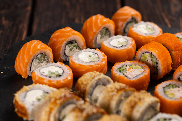 Rolls set with fish shrimp and caviar sushi with chopsticks - asian food and japanese cuisine concept