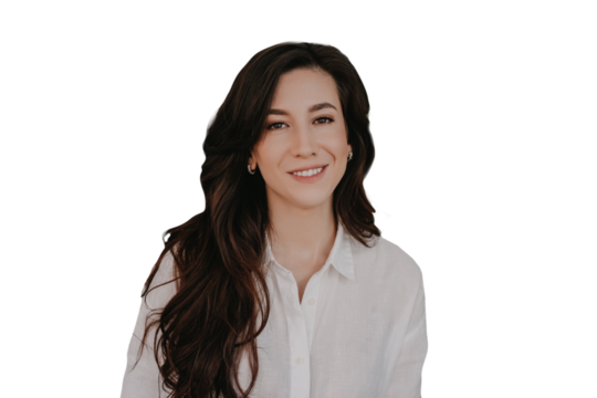 Portrait of cheerful brunette Hispanic woman toothy smiling looks at camera against transparent background. Gorgeous businesswoman with wavy long har dressed in white shirt. Successful people.