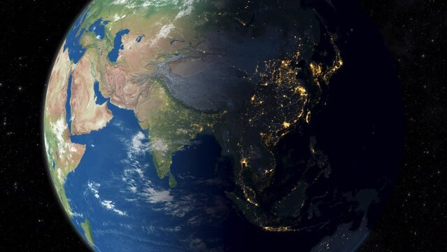 Realistic Earth rotating. Day to night transition as seen from space. Glowing bright cities lights shine at asia.Asian map.