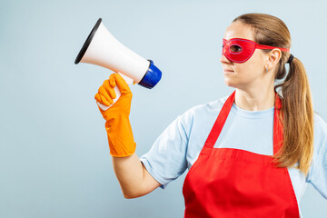 Woman in red mask, gloves and apron with megaphone on blue background