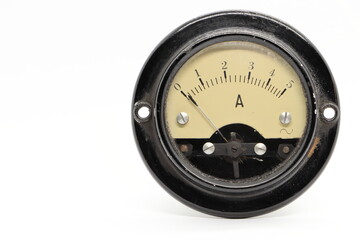 Old analog ammeter on a white background. Measurement of electric current.