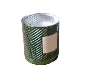 Cylindrical green candle holder with white candle and blank lable as an isolated object