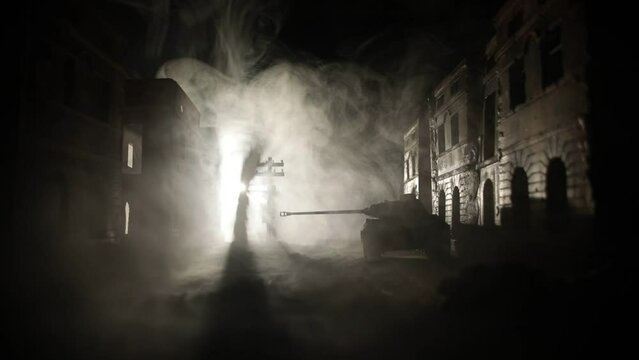War Concept. Military silhouettes fighting scene on war fog sky background, World War Soldiers Silhouette Below Cloudy Skyline At night. Battle in ruined city. Selective focus