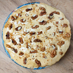 Honey cake decorated with nuts. Home cooking.