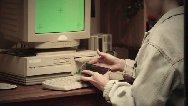Vintage Retro PC, Using cd diskette for old computer. Music recorder, playing retro computer games. Vintage device for office, obsolete technology. 